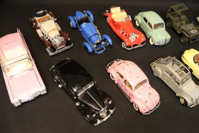 several toy cars are lined up in a row on a black surface