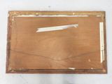 an old picture of a piece of wood with a piece of paper on it