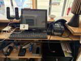 a laptop computer sitting on a desk with a keyboard and mouse