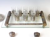 a tray with glasses and a tray with rocks on it