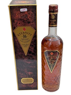 an image of a bottle of whisky sitting next to a box