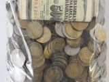a bag full of coins sitting on a table
