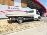 a white truck that is parked in front of a building