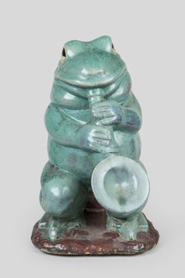 a statue of a frog with a hat on it ' s head