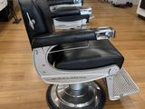 a row of barber chairs in a hair salon
