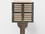 a close up of a metal and wood light fixture on a wall