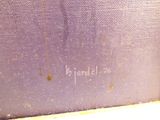 a close up of a purple suitcase with writing on it