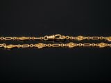 a gold plated chain bracelet with a clasp