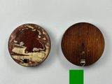 two wooden buttons with a picture of a bear on them