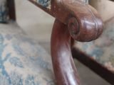 a wooden chair with a blue and white upholstered upholstered upholstered upholstered upholstered upholstered