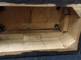 a small wooden box with a bunch of bananas inside of it