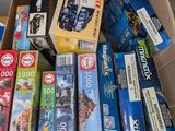 a box full of assorted toys and games for sale