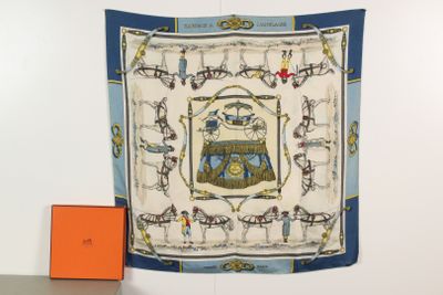 a scarf hanging on the wall next to an orange box