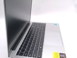 a close up of a laptop computer on a white surface