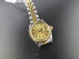 a close up of a watch on a table on a table