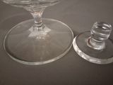 two empty wine glasses sitting on a table
