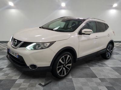 the white nissan qx sport suv is parked in the garage