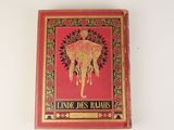 an old red book with a picture of an elephant on it ' s cover