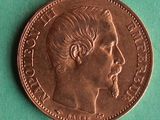 a close up of a coin with a man ' s face on it