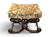 an image of a foot stool with a floral design on it