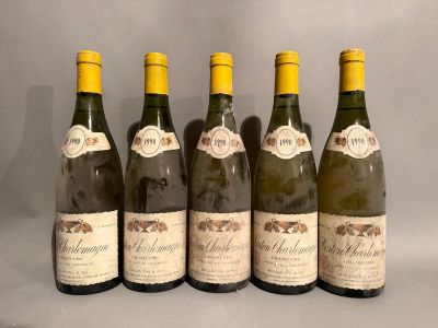six bottles of wine are lined up in a row