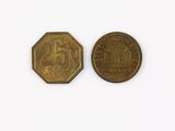 two gold coins are shown side by side on a white surface