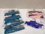 four pairs of blue and pink shoes on a white table