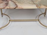 an image of a marble top coffee table with brass legs