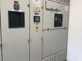 a room with a bunch of electrical equipment in it