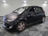 a picture of a black car parked in a garage