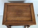 a small wooden table with a bowl on top of it