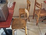 tables and chairs in a restaurant with a microwave on top of them