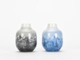 two vases sitting side by side on a white surface