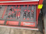 a red tool box with many tools inside of it
