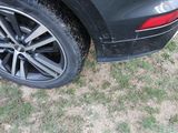 a close up of a car tire on the grass