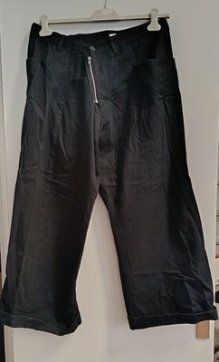 the pants are black and have zippers on them