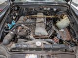 a car engine that is sitting in the trunk of a car