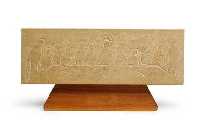 a carved stone plaque with birds on it on a wooden stand