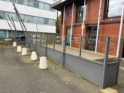 a building that has a bunch of poles in front of it