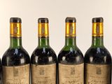 six bottles of wine are lined up in a row