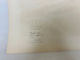 a piece of paper with writing on it sitting on a table