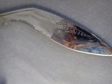 a knife that is laying on top of a piece of cloth
