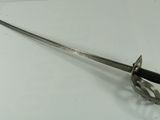 an image of a sword on a white surface