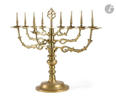 a large brass candelab with five candles on a stand