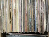 a box full of old records sitting on top of a table