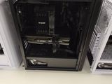 a small black computer case sitting on top of a white table