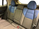 the back seats of a car are blue and tan