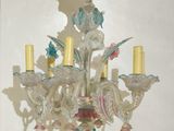 a glass chandelier hanging from the ceiling