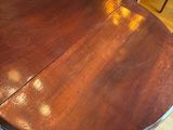 an image of a dining room table with chairs around it