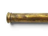 a close up of a brass pipe on a white surface